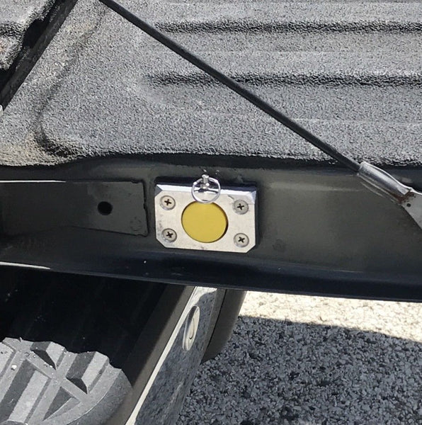 The HiddenHook Extendable Cargo Retrieval Tool stored securely in the tailgate