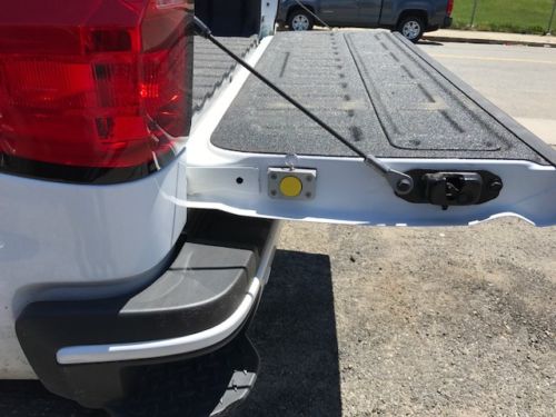 The HiddenHook Extendable Cargo Retrieval Tool stored securely in the tailgate
